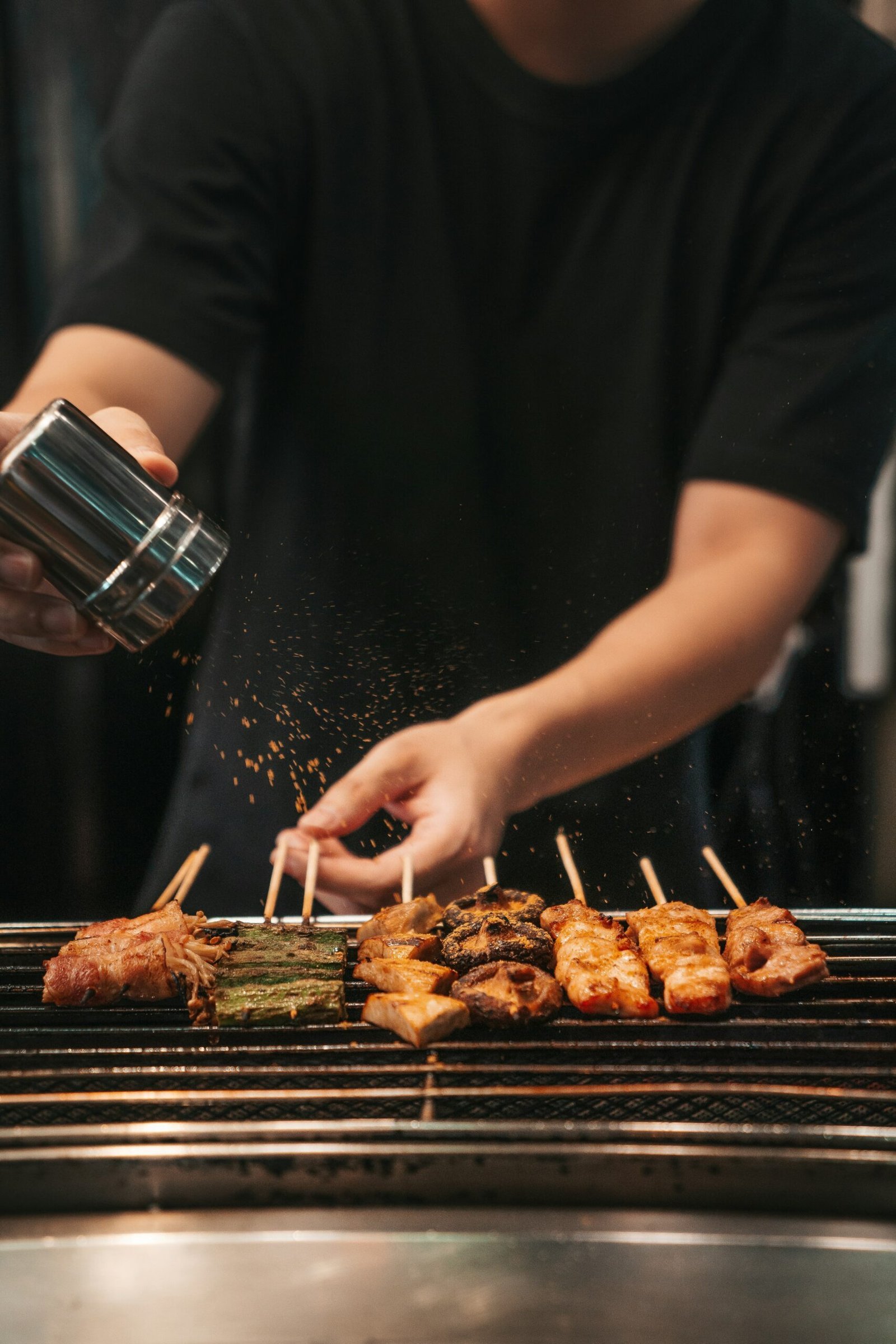 person holding stainless steel cup