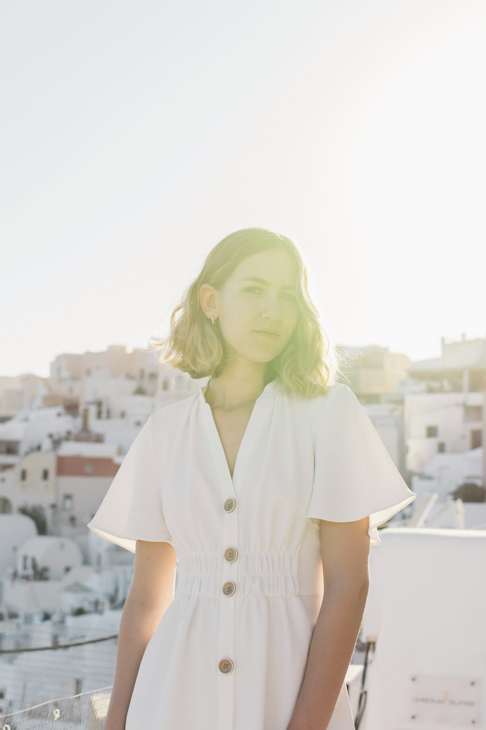 shallow focus photo of woman in white dress